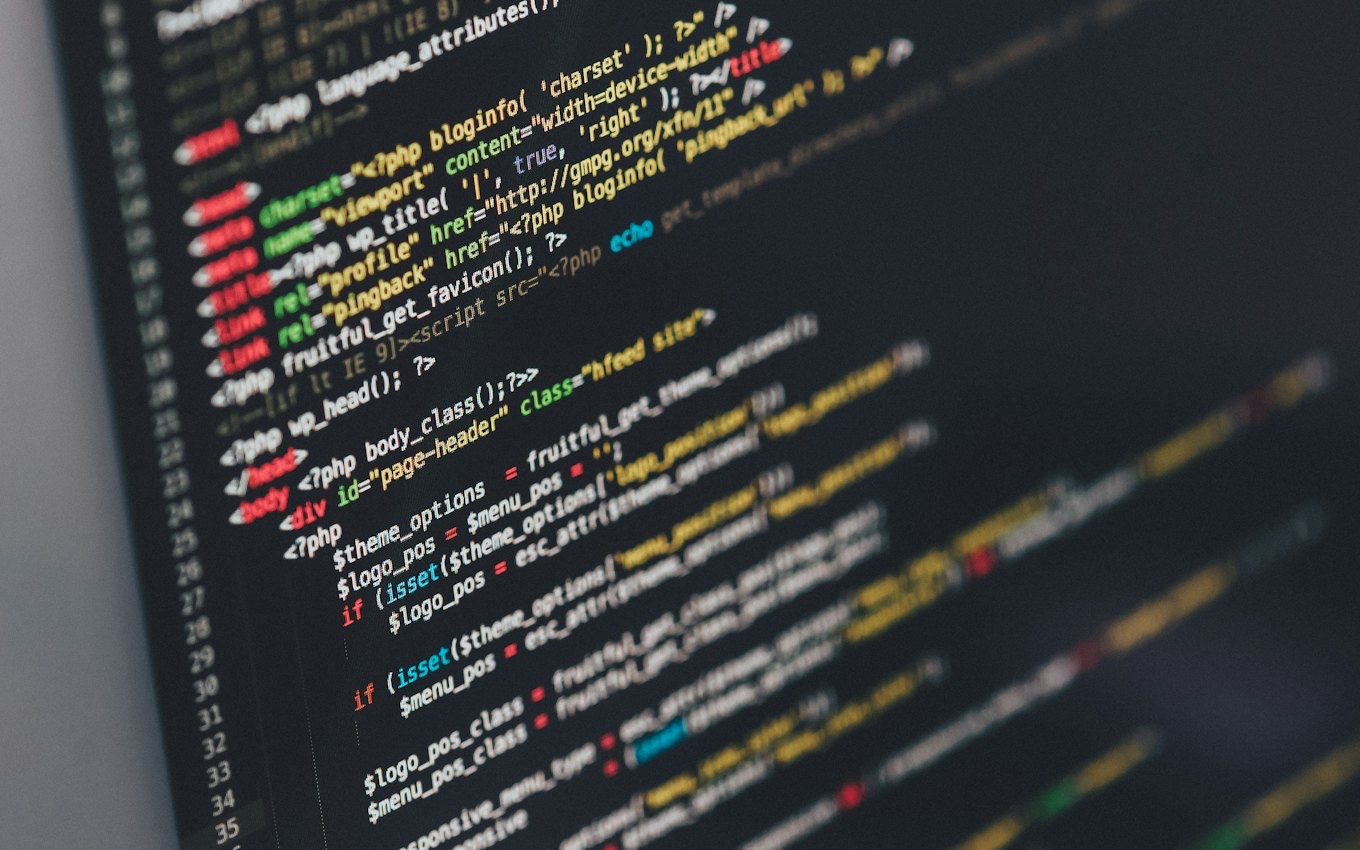 A monitor showing lines of program code