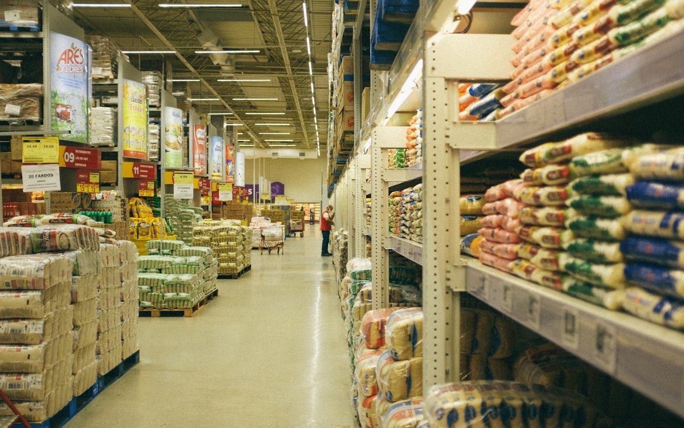 A supermarket aisle with stocked shelves